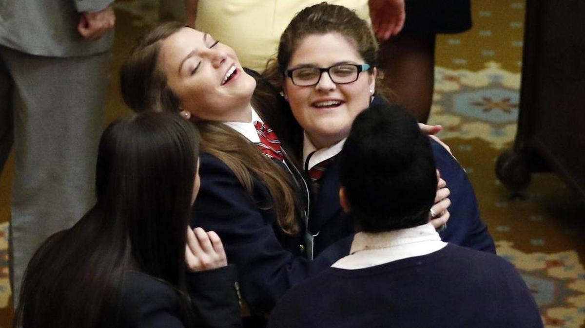 House pages hug and celebrate their last day as the Mississippi Legislature ended its 2017 regular session Wednesday at the Capitol in Jackson.