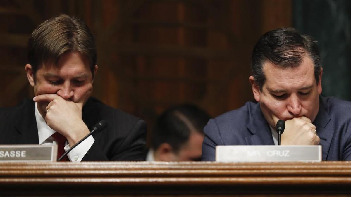 Senate Judiciary Committee members Sen. Ben Sasse, R-Neb., left, and Sen. Ted Cruz, R-Texas, listen on Capitol Hill in Washington on May 3, as FBI Director James Comey testifies.