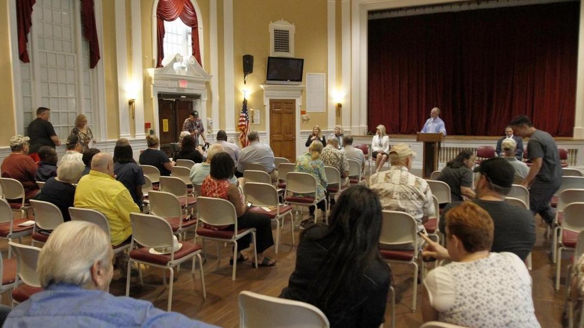 A crowd gathers to ask questions about their health care or tell of experiences at the Biloxi VA Hospital during town hall meeting Thursday.