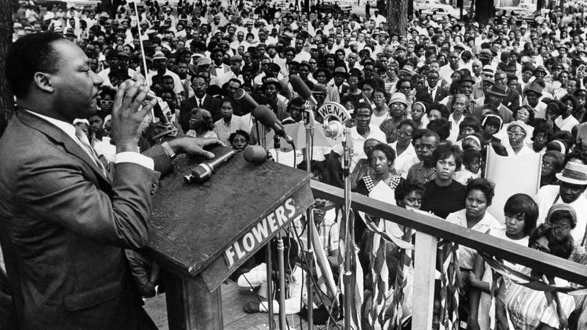 In this April 30, 1966 photo, The Rev. Martin Luther King Jr. addresses a crowd of some 3,000 persons in Birmingham, Ala., in Kelly Ingram Park on the last day of his three-day whistle-stop tour of Alabama, encouraging black voters to vote as a bloc in the primary election.