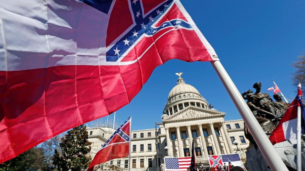 Sons of Confederate Veterans and other groups parade on the grounds of the state Capitol in Jackson in January 2016 in support of keeping the Confederate battle emblem on the state flag.
