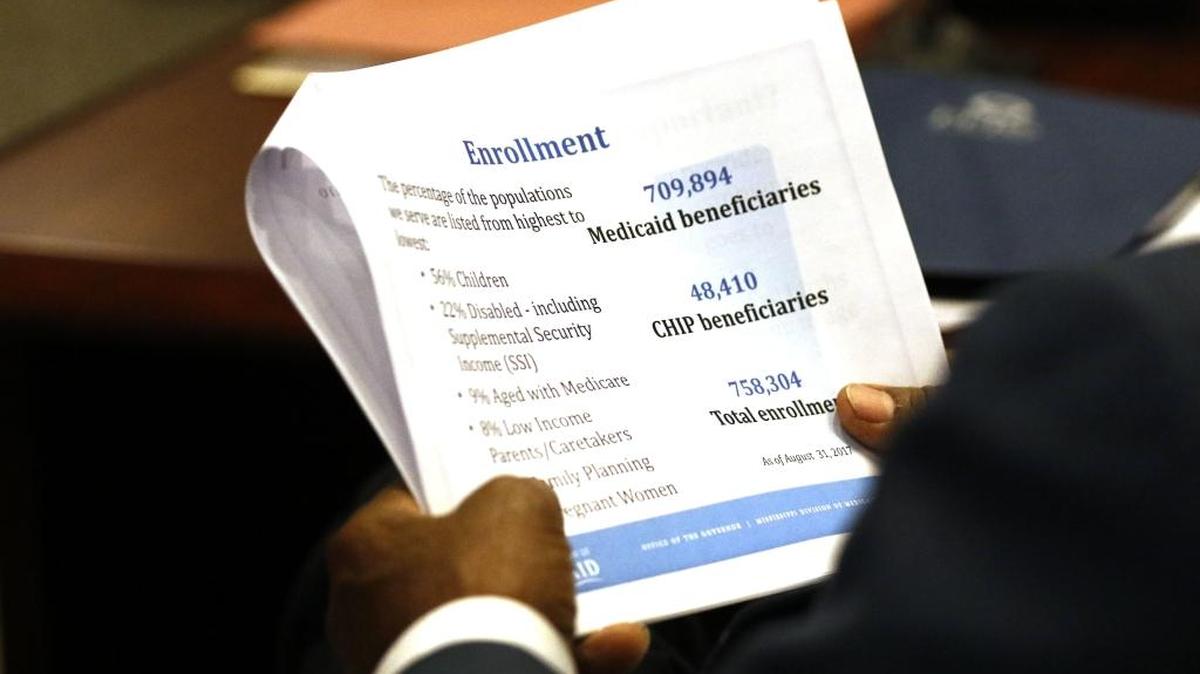 Joint Legislative Budget Committee member Rep. Credell Calhoun, D-Jackson, holds a copy of the state Department of Medicaid’s program review and budget request during a hearing in Jackson on Sept. 22. All state agencies presented their 2019 fiscal year requests.