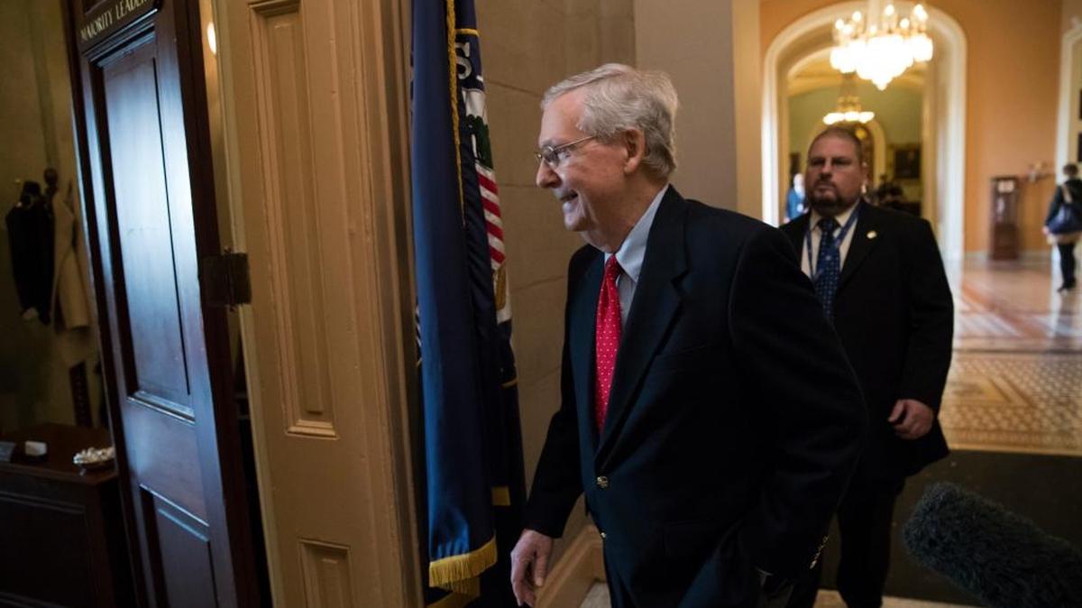 Senate Majority Leader Mitch McConnell, R-Ky., walks from the chamber to his office as the GOP overhaul of the tax bill nears a vote, on Capitol Hill in Washington, Friday, Dec. 1, 2017.