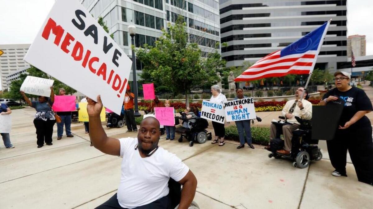 Mario Henderson leads chants of "save Medicaid," as other social service activists, Medicaid recipients and their supporters stage a protest outside the building that houses the offices of U.S. Sen. Thad Cochran, R-Miss., Thursday, June 29, 2017, in Jackson, Miss. Soaring prices and fewer choices may greet customers when they return to the Affordable Care Act’s insurance marketplaces in the fall of 2017, in part because insurers are facing deep uncertainty about whether the Trump administration will continue to make key subsidy payments and enforce other parts of the existing law that help control prices.