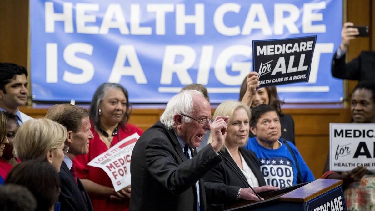 Sen. Bernie Sanders, I-Vt., center, accompanied by Sen. Kirsten Gillibrand, D-N.Y., center right, speaks at a news conference on Capitol Hill in Washington on Sept. 13 to unveil their Medicare for All legislation to reform health care.