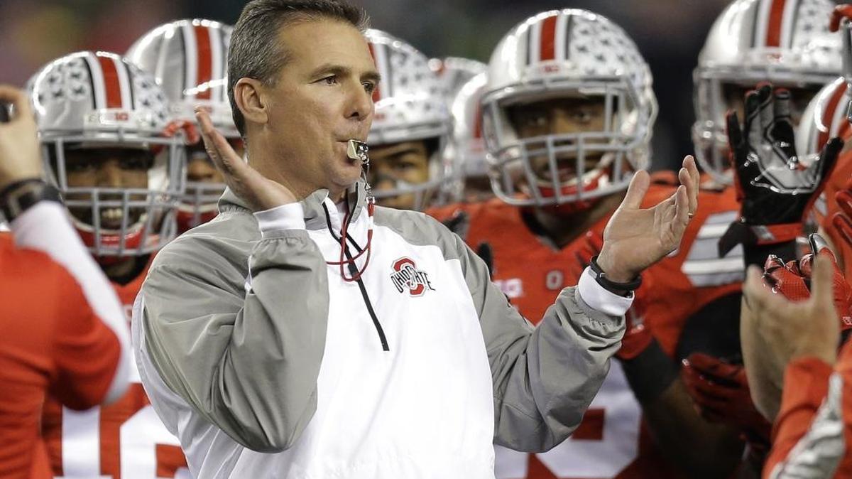 FILE - In this Jan. 12, 2015, file photo, Ohio State head coach Urban Meyer rallies his players before the NCAA college football playoff championship game against Oregon in Arlington, Texas. A Sound Off reader says college football is getting to be too much like big business.