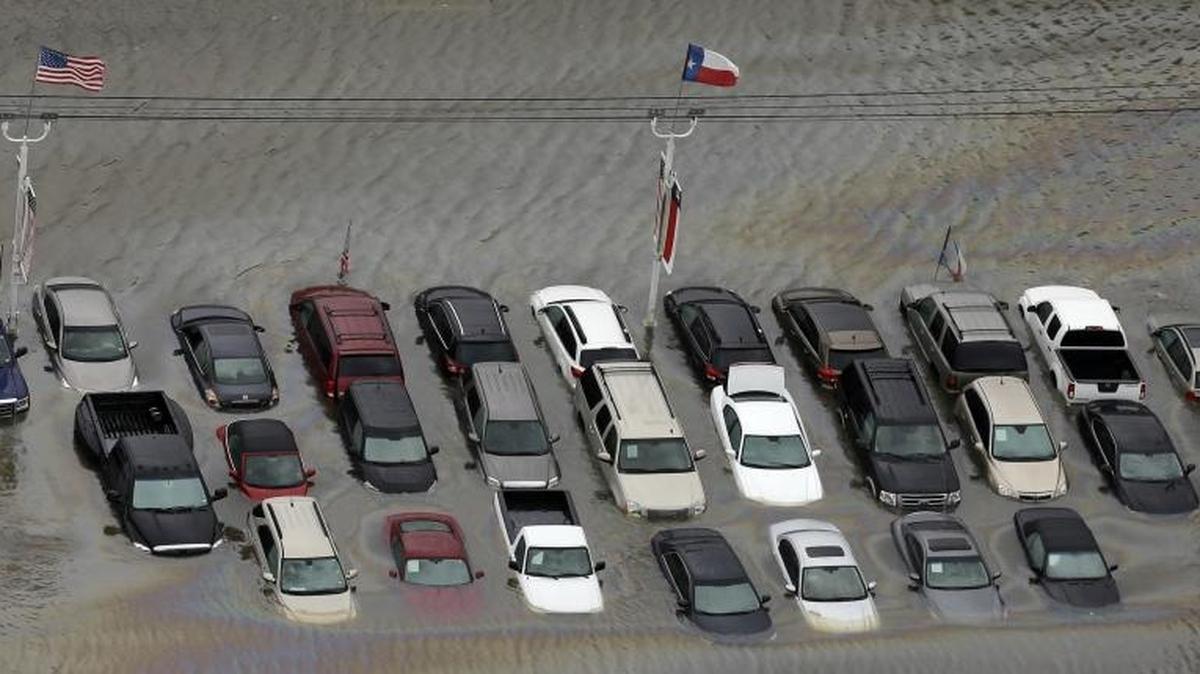 FILE - Cars are flooded near the Addicks Reservoir as floodwaters from Tropical Storm Harvey rise in Houston. (AP Photo/David J. Phillip, File)