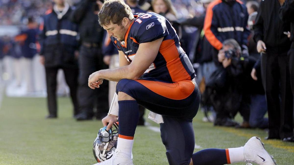 Denver Broncos quarterback Tim Tebow (15) prays in the end zone before the start of an NFL football game against the Chicago Bears, Sunday, Dec. 11, 2011, in Denver.