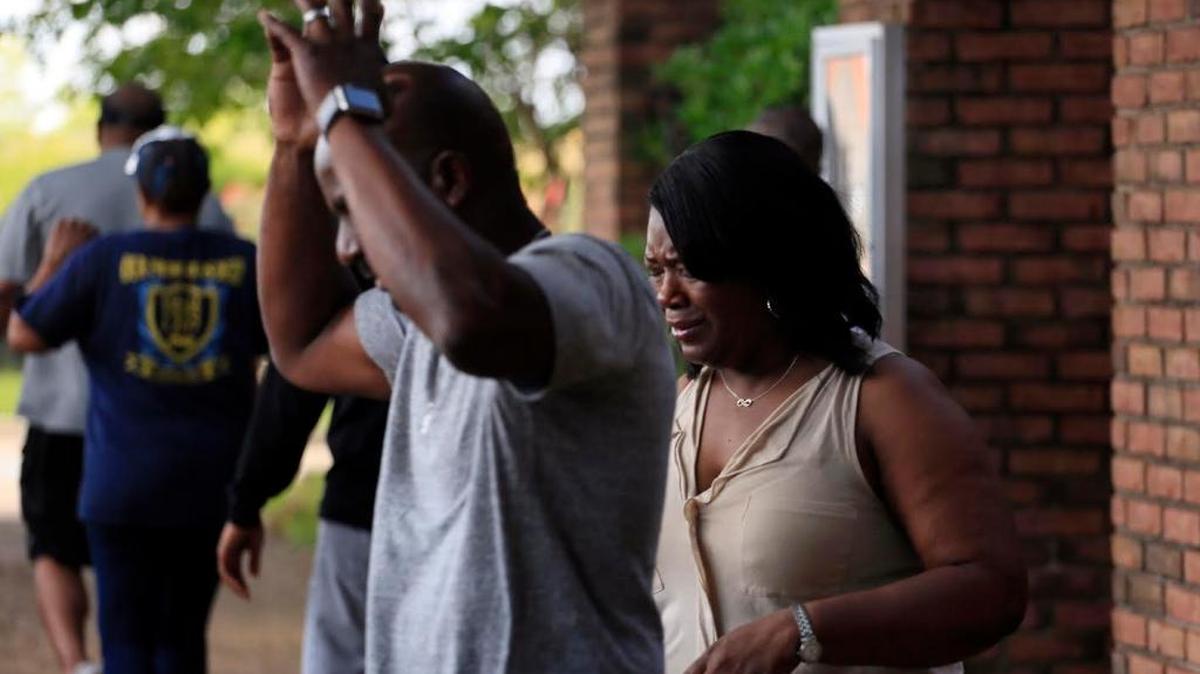 Family members react after learning that Kingston Frazier was found dead after being kidnapped during the theft of his mother's vehicle from a Kroger parking lot Thursday, May 18, 2017, in Jackson, Miss.