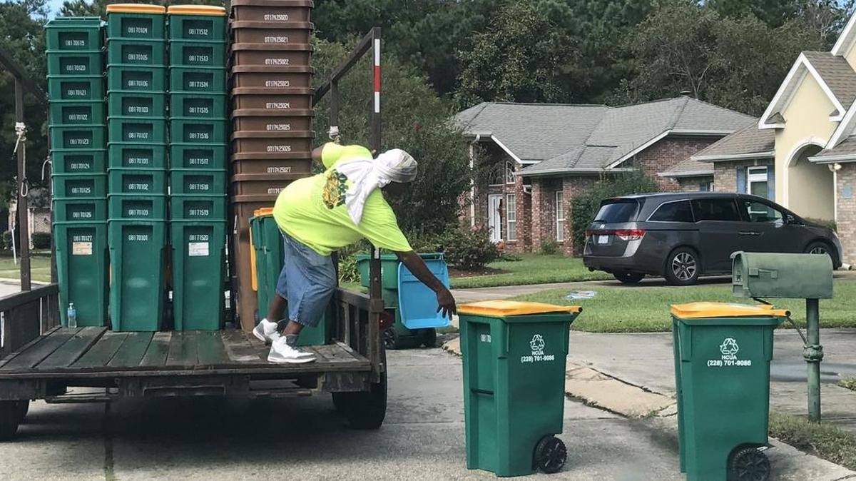 Kenneth Cuffee of Gulfport puts new recycling bins out in Biloxi for Team Waste on Monday, Sept. 25, 2017. A new contract for all of Harrison County except Gulfport goes into effect on Oct. 1.