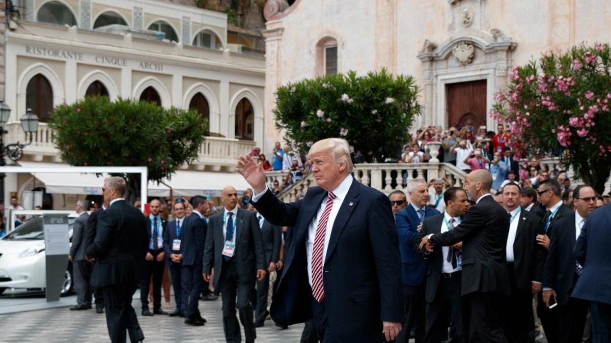 President Donald Trump waves as he takes a walking tour during the G7 Summit, Friday, May 26, 2017, in Taormina, Italy.