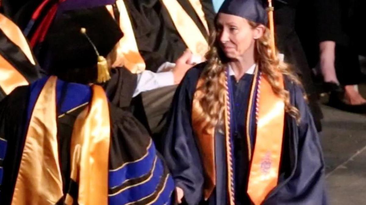 Melissa Estes receives her associate's degree Thursday evening during Mississippi Gulf Coast Community College graduation at the Coast Coliseum in Biloxi on May 11, 2017. Estes was medically discharged from the Seabees after suffering a traumatic brain injury in Afghanistan.
