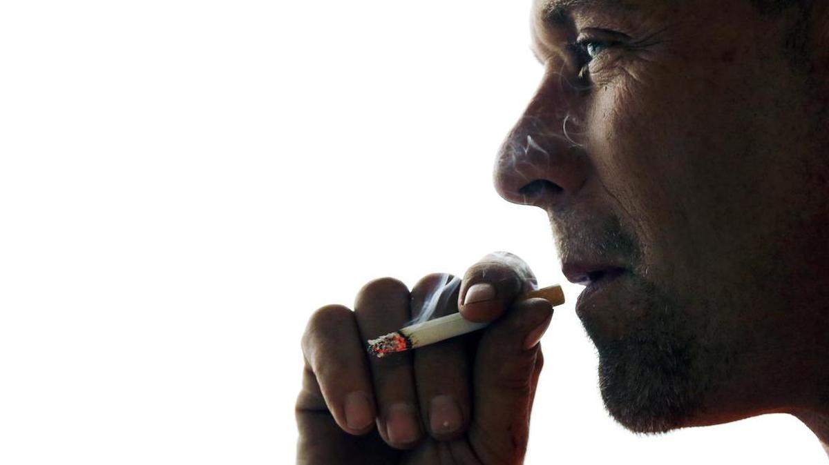 John Cormier smokes a cigarette on Main Street in Westminster, Mass., Thursday, Nov. 6, 2014. A Sound Off reader feels hospitals should show “compassion and comfort” to smokers.