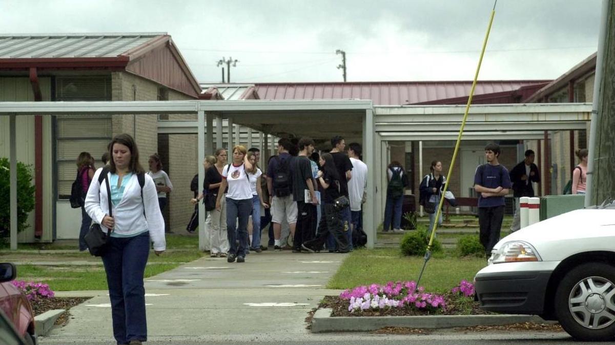 
Students of Long Beach High School leave school Tuesday.
