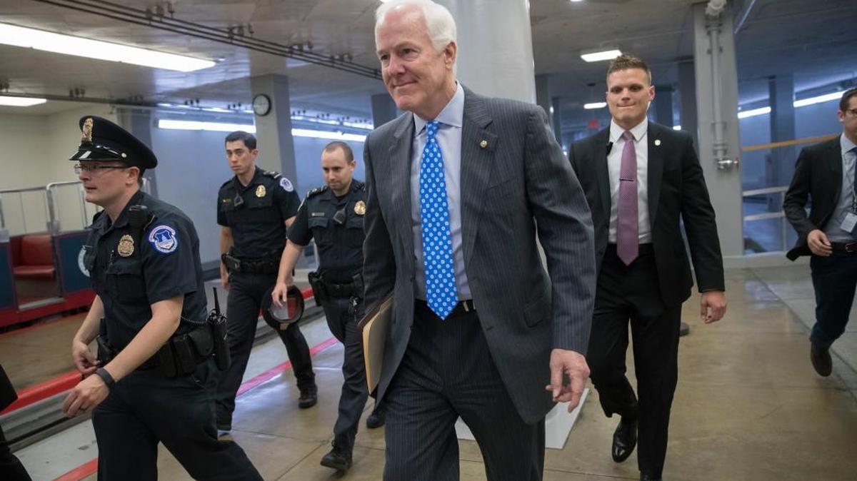 Senate Majority Whip John Cornyn, R-Texas, heads to a caucus meeting with Senate Majority Leader Mitch McConnell, R-Ky., as they struggle with senators who are opposed or wavering on the Republican health care bill, at the Capitol in Washington, Tuesday, June 27, 2017. In a bruising setback, Senate Republican leaders decided to delay a vote on their prized health care bill until after the July 4 recess, forced to retreat by a GOP rebellion that left them lacking enough votes to even begin debating the legislation.