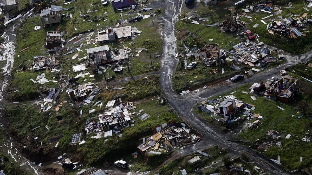The rubble of homes are scattered in the aftermath of Hurricane Maria in Toa Alta, Puerto Rico, one week after the storm hit in September 2017.