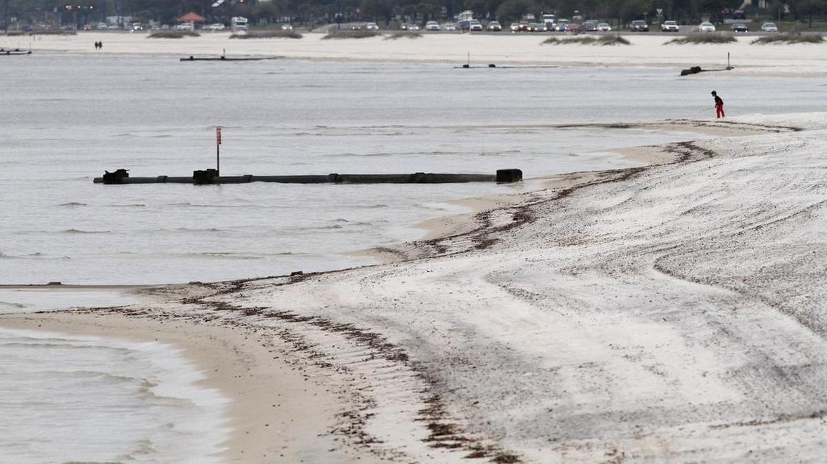 A young boy plays on the beach in Gulfport on Monday, March 13, 2017. It will cost Harrison County at least $3 million to replenish the beach to the end of the drainage culverts at left.