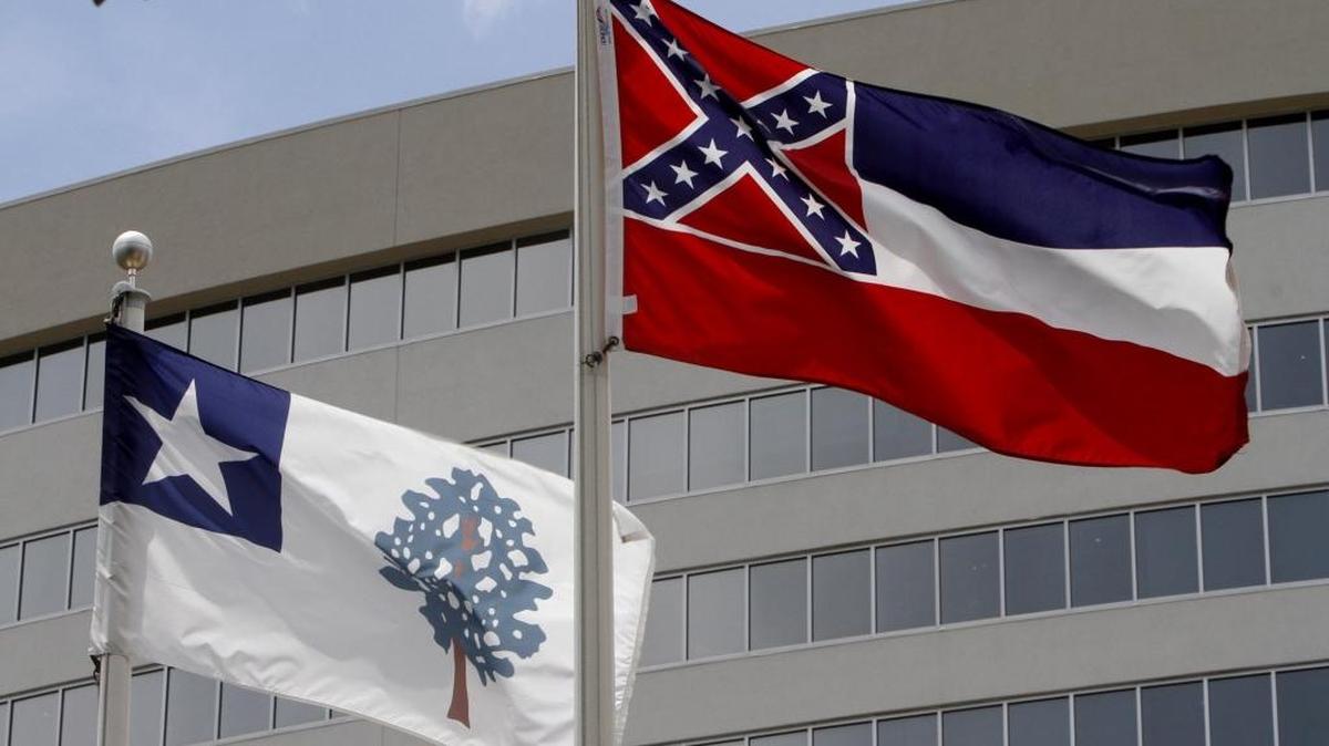 Mississippi's two state flags fly side-by-side at the Eight Flags display in Biloxi, Friday, July 10, 2015. The Magnolia flag was Mississippi's official flag from 1861 - 1865. The Magnolia flag remained the unofficial flag until 1894. The current Mississippi flag, which features the Confederate battle flag, was adopted as the state flag in 1894.