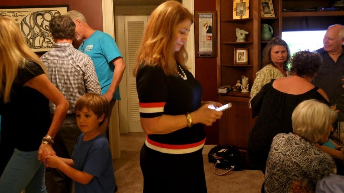Connie Moran checks her phone while waiting for results in the Ocean Springs mayor race on Tuesday, June 6, 2017. Moran was defeated by Shea Dobson.