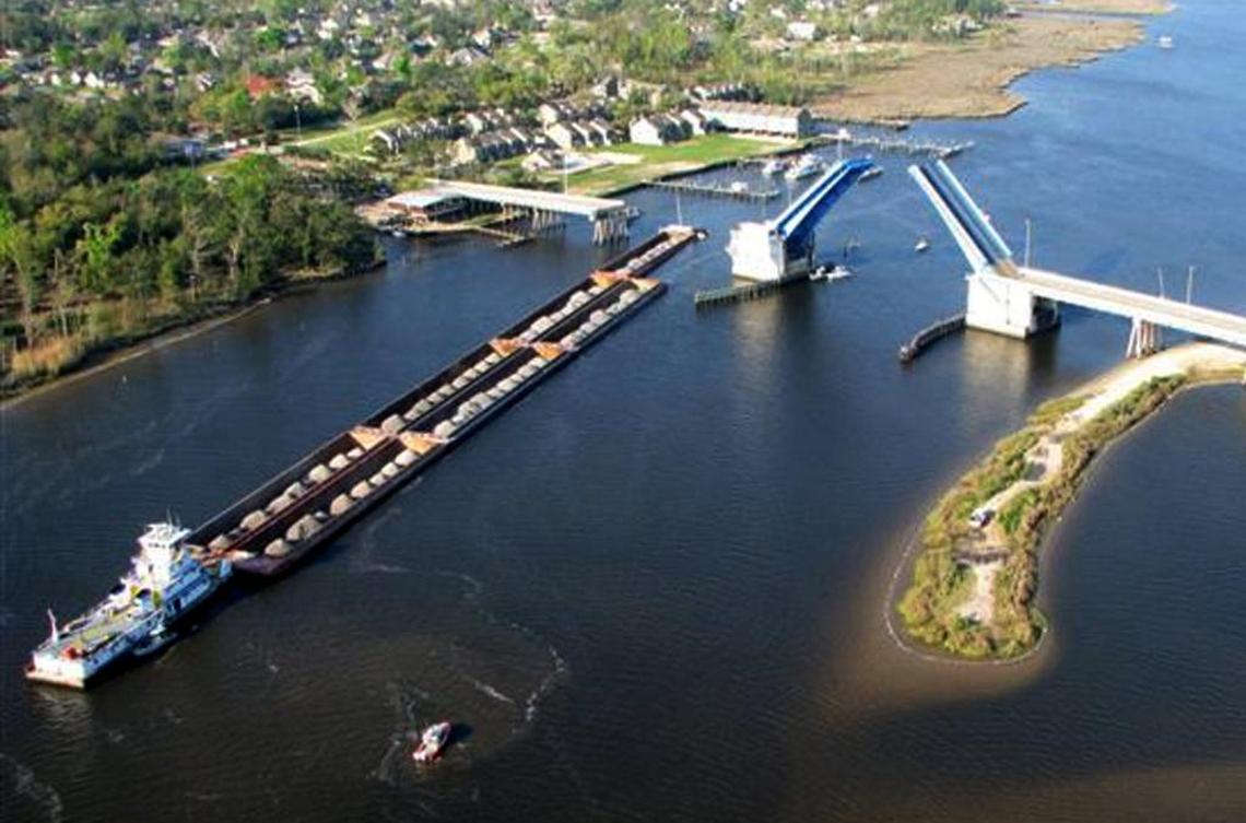 A span of the Popp’s Ferry Bridge in Biloxi, Mississippi, crashed into the bay after the bridge was hit by a tug boat towing eight barges.
