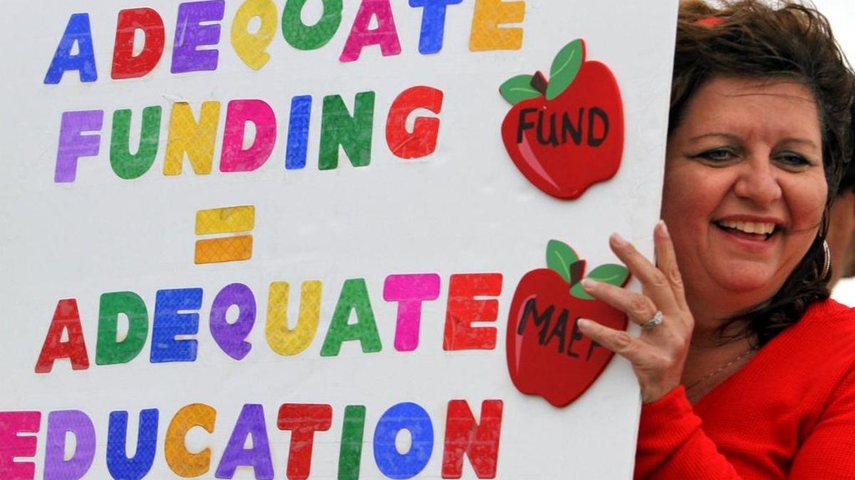 Angela Ryland shows support for education funding during a rally in Gulfport in 2010.