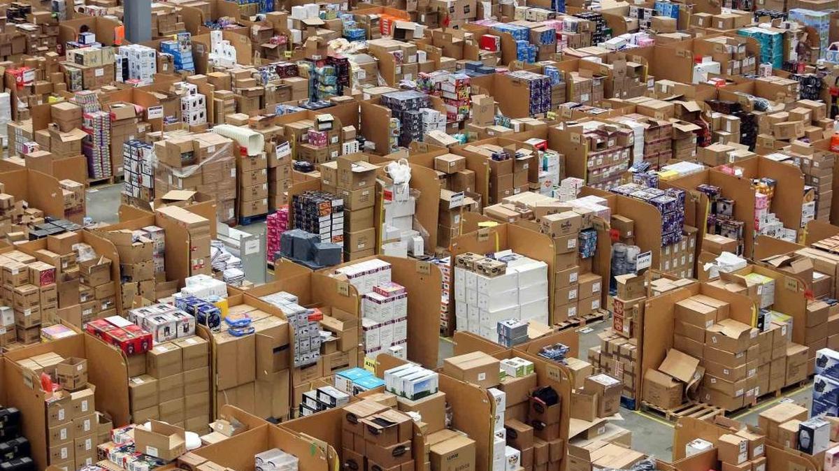 Goods stand stacked at the Amazon.com fulfillment center in Hemel Hempstead, England, in 2015.