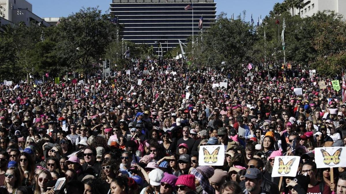 Protesters listen to speeches at the Grand Park during a Women's March, Saturday, Jan. 20, 2018, in Los Angeles.