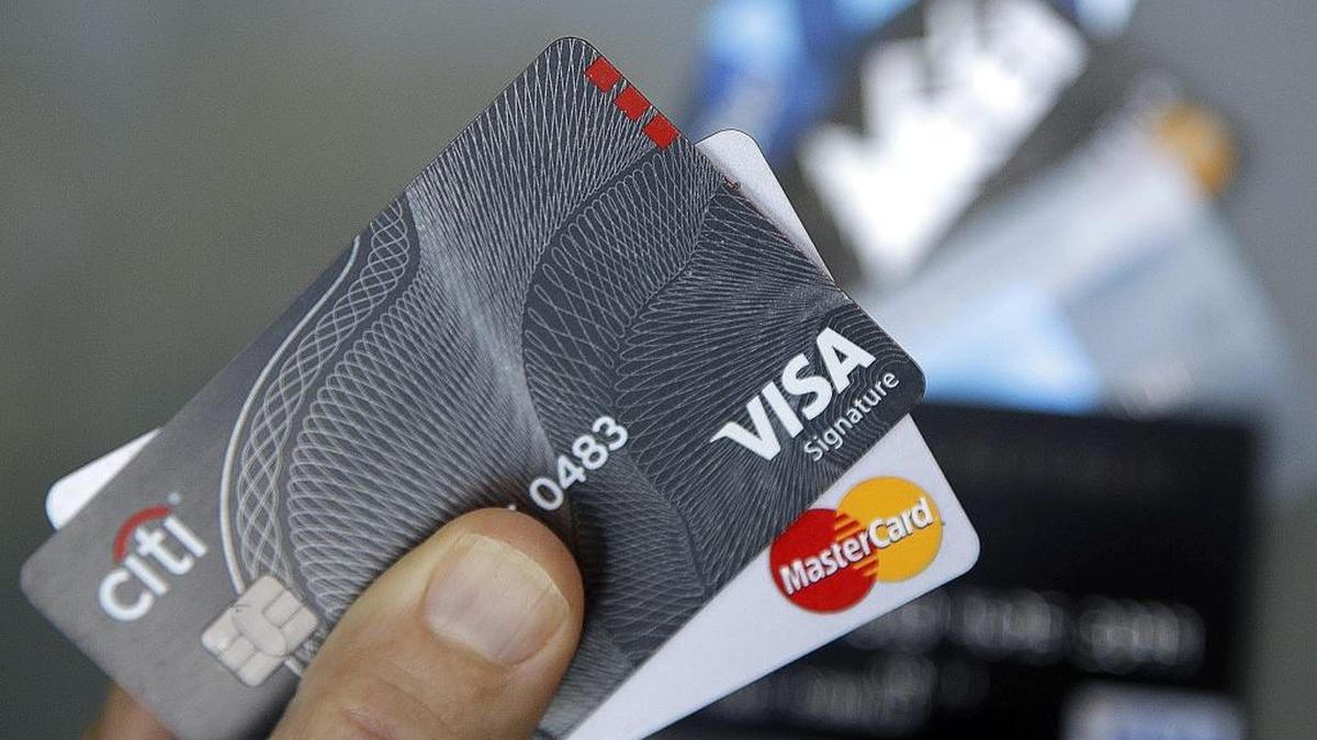 In this June 15, 2017, file photo, credit cards are displayed in Haverhill, Mass.