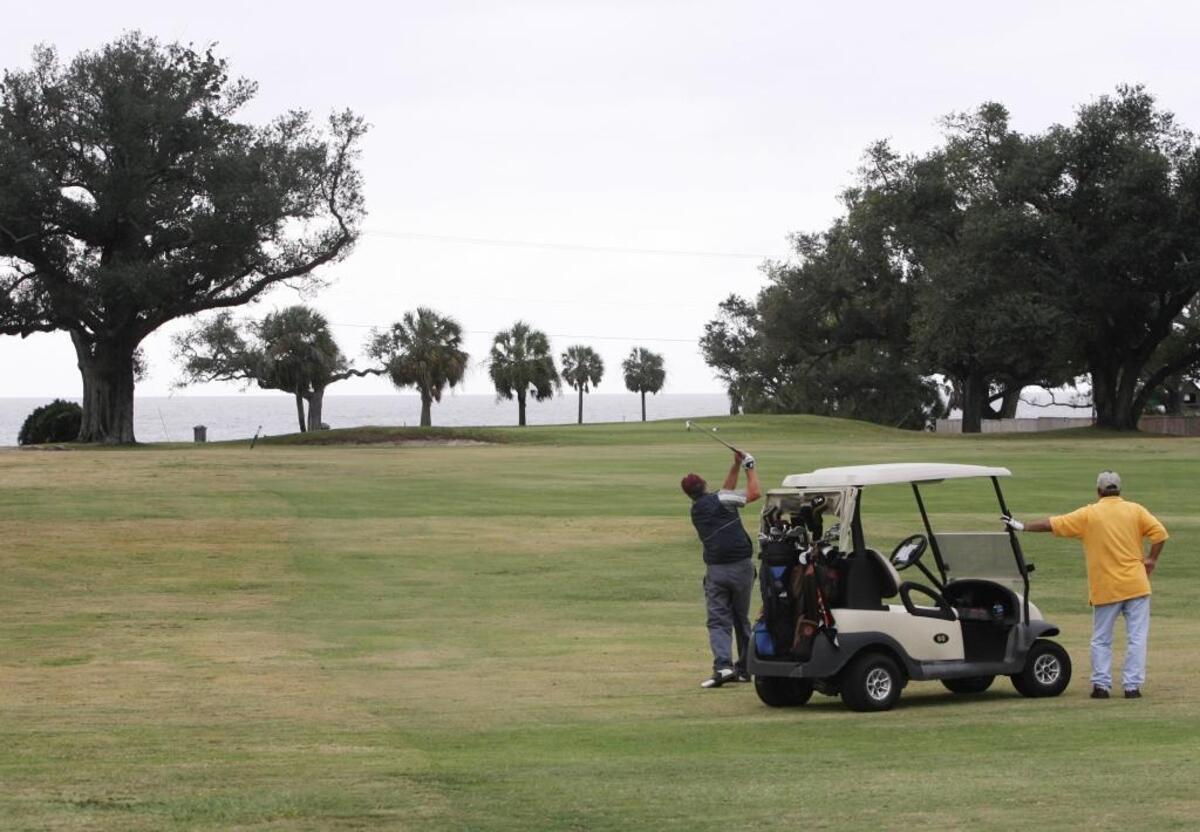 Phillip Scarbrough, left, and Stephen Byrd of Meridian play golf at the Great Southern Golf Club in Gulfport.