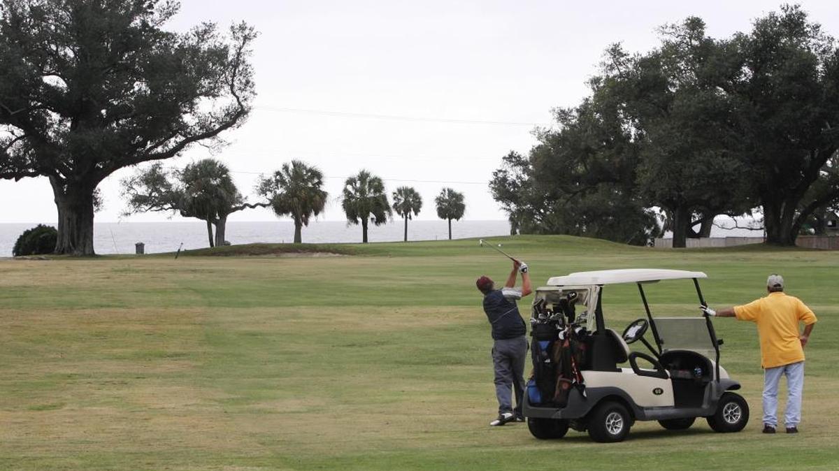 Phillip Scarbrough, left, and Stephen Byrd of Meridian play golf at the Great Southern Golf Club in Gulfport.