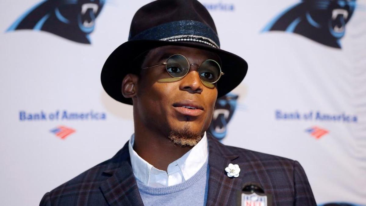 In this Oct. 1, 2017, file photo, Carolina Panthers quarterback Cam Newton speaks to the media following an NFL football game against the Carolina Panthers, in Foxborough, Mass. Dannon, the maker of Oikos yogurt, is cutting ties with spokesman Cam Newton following sexist comments the Carolina quarterback made to a female reporter.