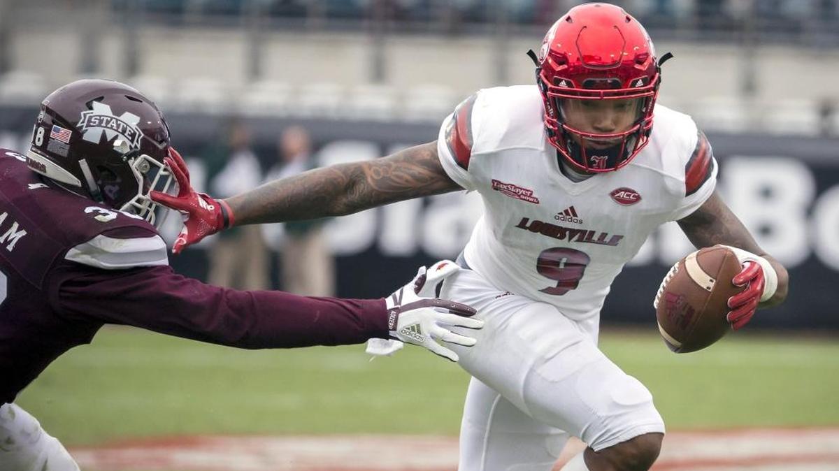 Louisville wide receiver Jaylen Smith (9) out runs the tackle by Mississippi State defensive back Johnathan Abram (38) during the first half of the TaxSlayer Bowl on Dec. 30, 2017, in Jacksonville, Fla.