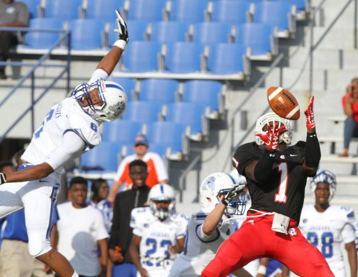 Harrison Central wide receiver Keon Moore grabs a pass over Jefferson Davis defender Jevonta Milton during the first quarter of their Port City Bowl Classic game at Milner Stadium on Gulfport on Aug. 18. Photographer’s comment: When a pass is so perfectly thrown that the defender just doesn’t have a chance.