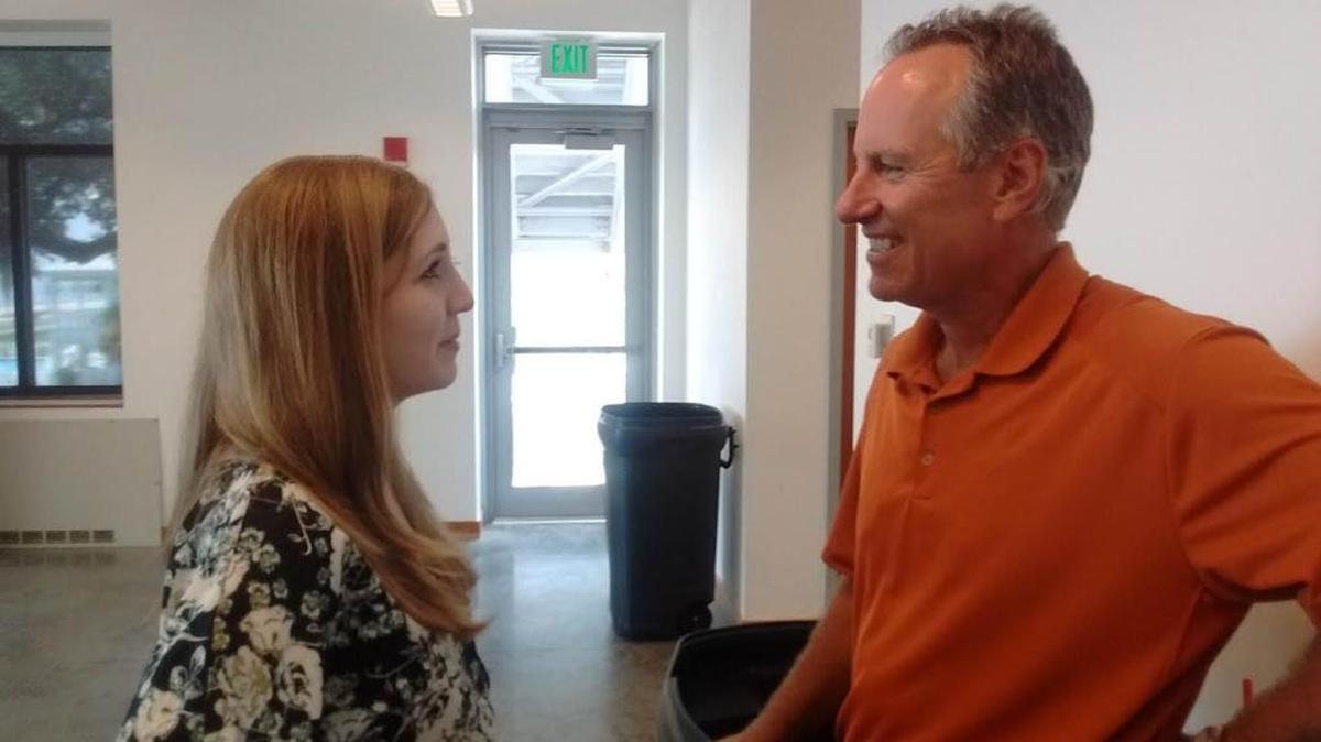 Rhea Miner (left), assistant curator at the Ohr-O'Keefe Museum of Art, speaks to Greg Litton after his presentation at the museum's Our Love Affair with Baseball luncheon Friday.