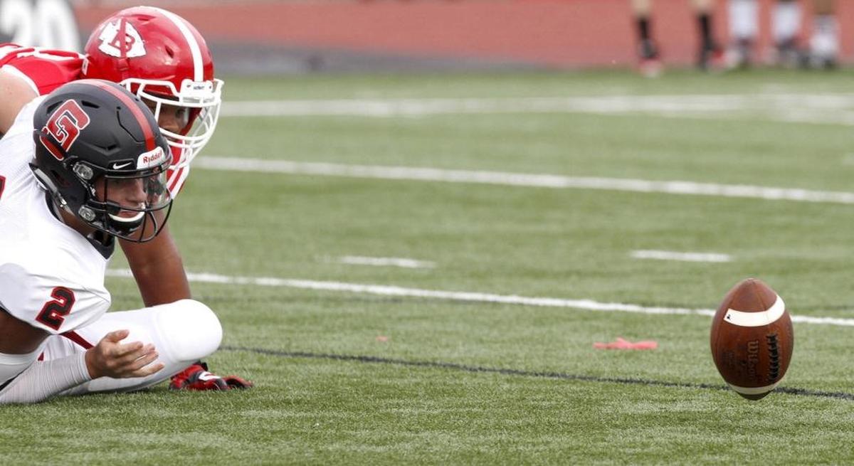 St. Stanislaus quarterback Jake Greer watches his fumble roll away from him at the Shrimp Bowl. Biloxi’s Riko Carter recovered the ball and scored a touchdown. Photographer’s comment: I liked the angle and crop that shows the quarterback looking at the fumble that got away.