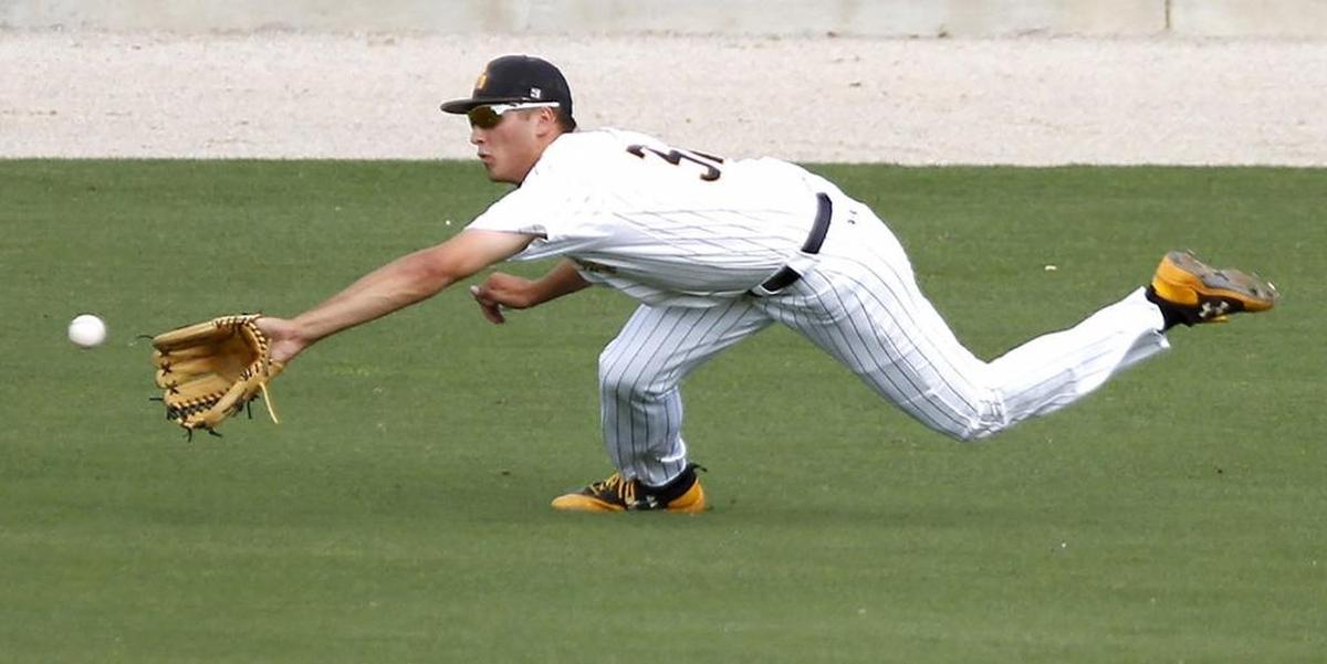 Matt Wallner of Southern Miss catches a deep shot to center field against UTSA during the C-USA baseball tournament in Biloxi. Photographer’s comment: The pressure was on as I had early deadlines and wanted to get a good shot. The San Antonio batter hit a shot to center field. I started firing the camera before I had a focus. I was able to get this in focus just at the peak action. Oh, I met my deadline, too.