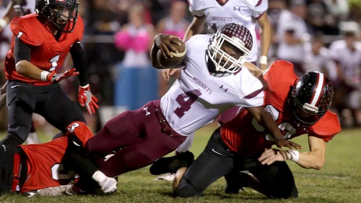 East Central running back Tony Brown is tackled by the St. Stanislaus defense on Friday, October 14, 2016, in Bay St. Louis. ECHS climbed into the Sun Herald’s Top 10 this week.