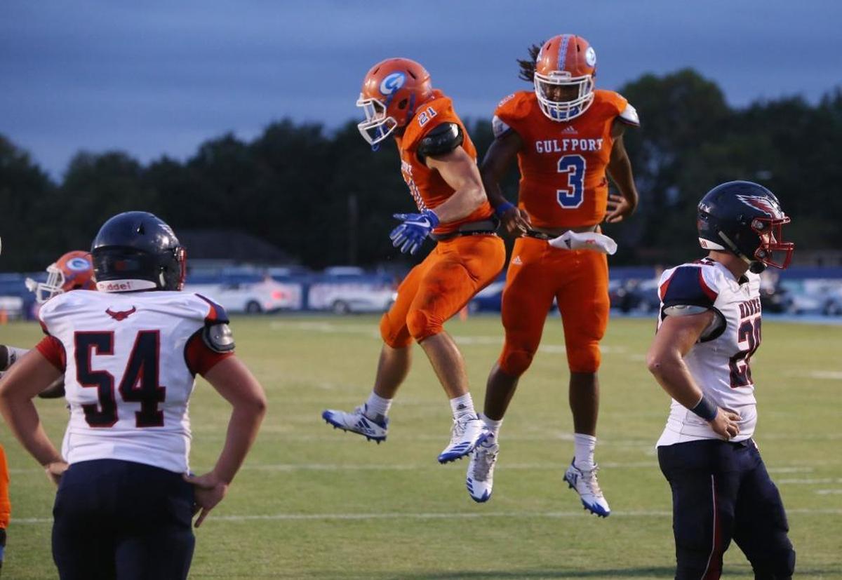 Gulfport quarterback T.Q. Newsome, right, and wing back Luke Dimitriades celebrate a touchdown pass against Hancock during the second quarter of their game at Milner Stadium in Gulfport on Oct. 6. Photographer’s comment: I like the contrast in body language of the celebrating Gulfport players and the downcast Hancock defenders.
