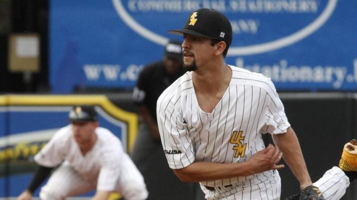 Southern Miss starting pitcher Nick Sandlin throws against Mississippi State during the first inning of their game at Pete Taylor Park in Hattiesburg on Feb. 16, 2018.