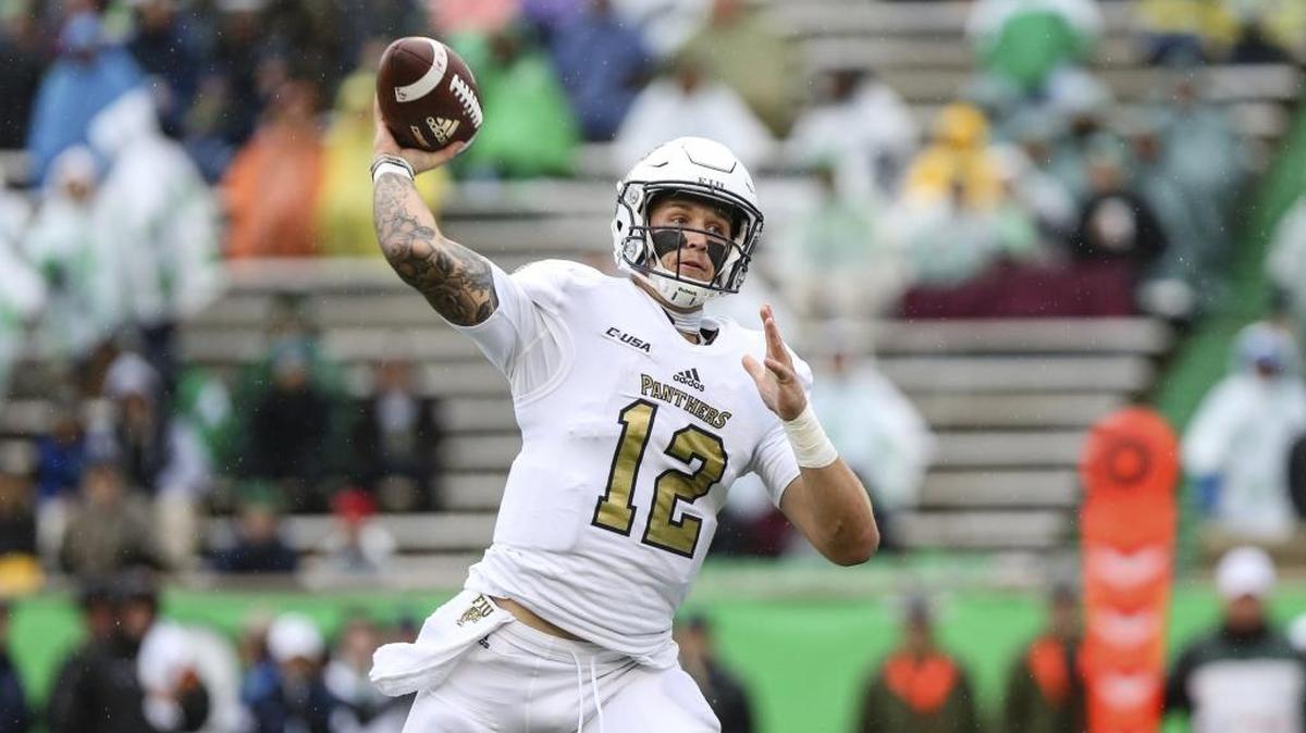 FIU quarterback Alex McGough (12) makes a throw against Marshall during a game on Oct. 28 at Joan C. Edwards Stadium in Huntington, W.Va.