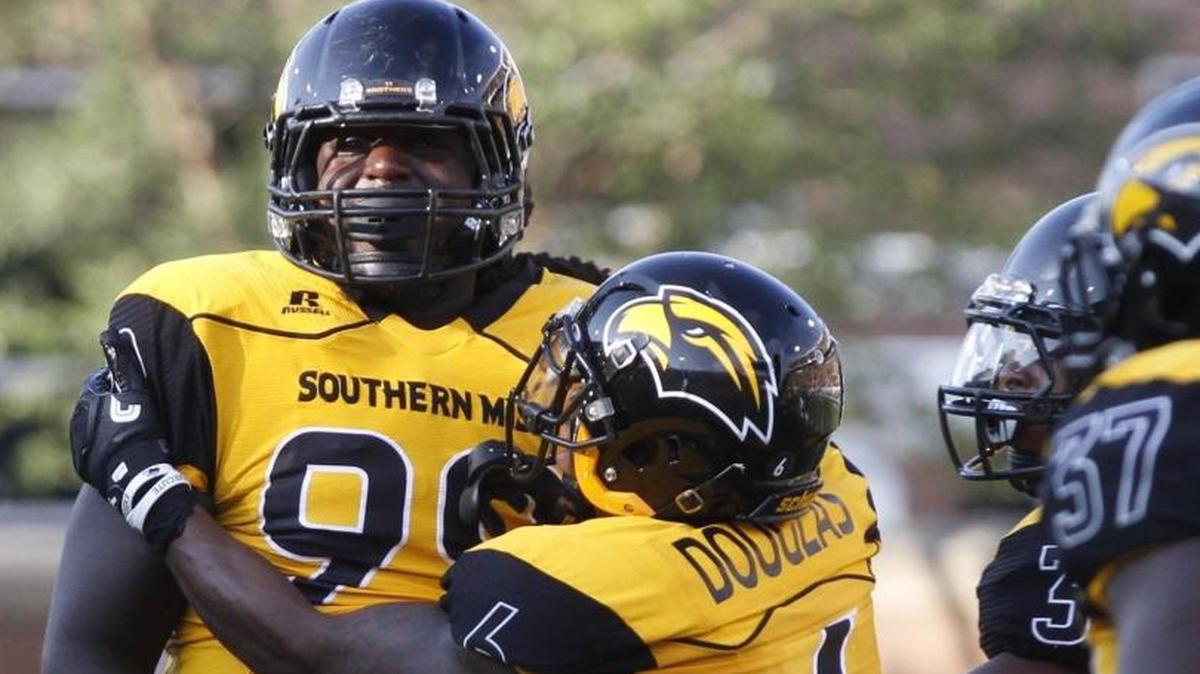Southern Miss defensive end Jacques Turner, left, and defensive back Kelsey Douglas celebrate a sack by Turner against Kentucky on Sept. 2 at Roberts Stadium in Hattiesburg.