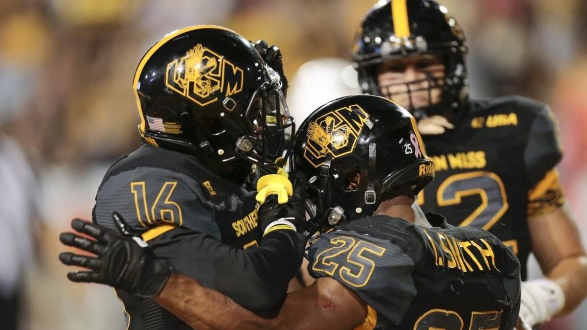 Southern Miss receiver Marquez Watkins (16) celebrates a touchdown with running back Ito Smith (25) against UTEp on Oct. 14 in Hattiesburg.