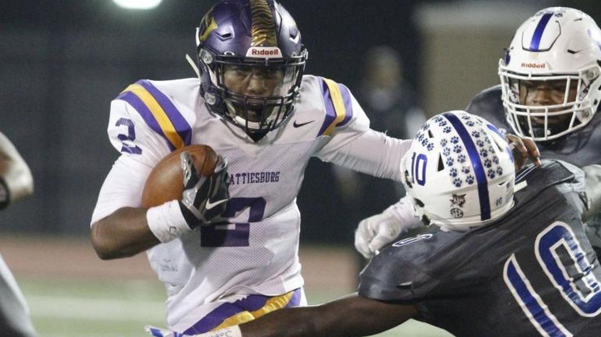 Stone linebacker Trey Arrington tries to tackle Hattiesburg quarterback Jarod Conner during the second quarter of their 5A playoff game at A.L. May Stadium in Perkinston on Nov. 17, 2017.
