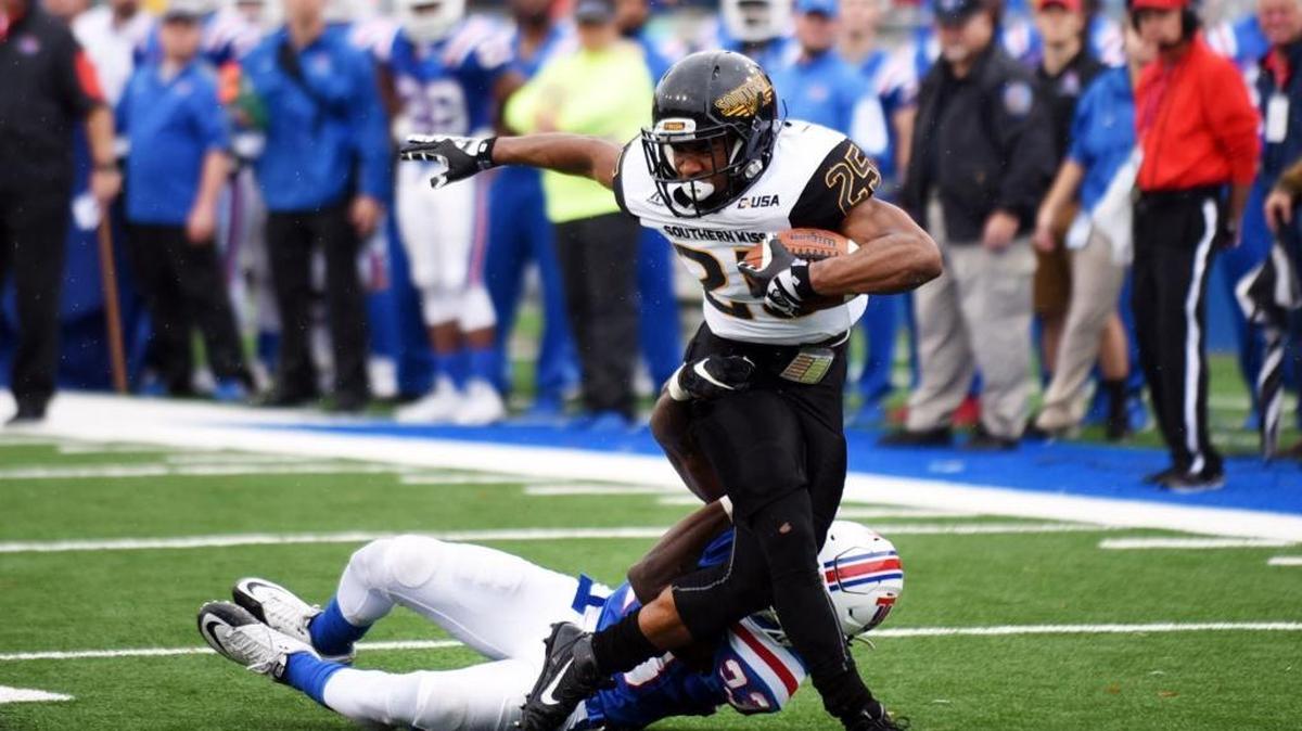 Southern Miss running back Ito Smith tries to work his way out of a tackle against Louisiana Tech on Nov. 28, 2015, in Ruston, La. USM won 58-24 in Ruston to clinch the C-USA West title.