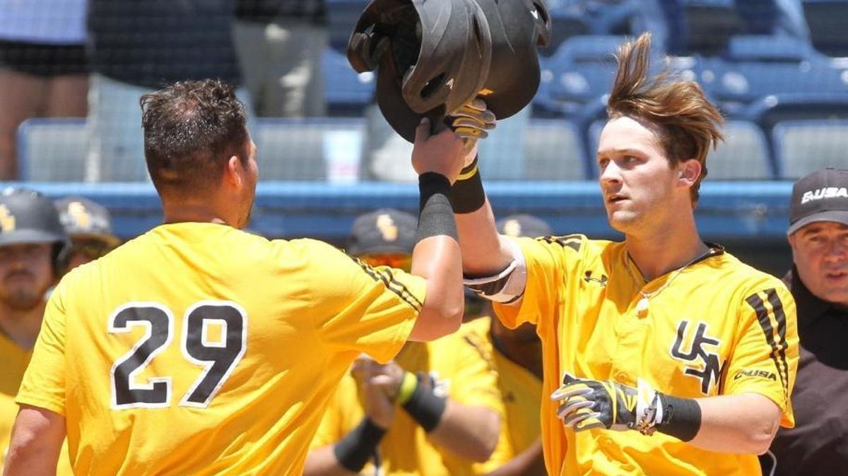 Southern Miss catcher Bryant Bowen(29) greets Matthew Guidry after hitting a three-run homer during the second inning of their C-USA tournament game against Louisiana Tech at MGM Park in Biloxi on May 25, 2017.