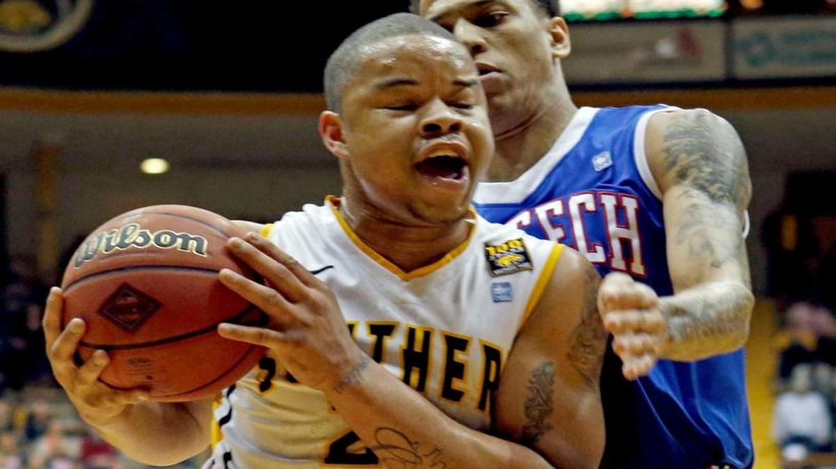 Southern Mississippi forward Jonathan Mills (24) drives against Louisiana Tech forward Michale Kyser (1) in the first half of their NIT college basketball game in Hattiesburg, Miss., Monday, March 25, 2013. Mills was reportedly shot to death Monday.