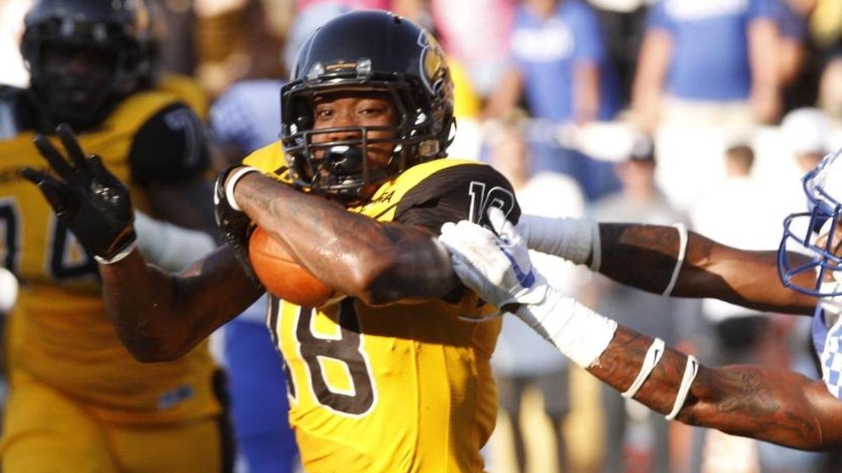 Kentucky cornerback Derrick Baity, Jr. reaches out for Southern Miss wide receiver Korey Robertson during the fourth quarter of their game at M.M. Roberts Stadium in Hattiesburg on Sept. 2.
