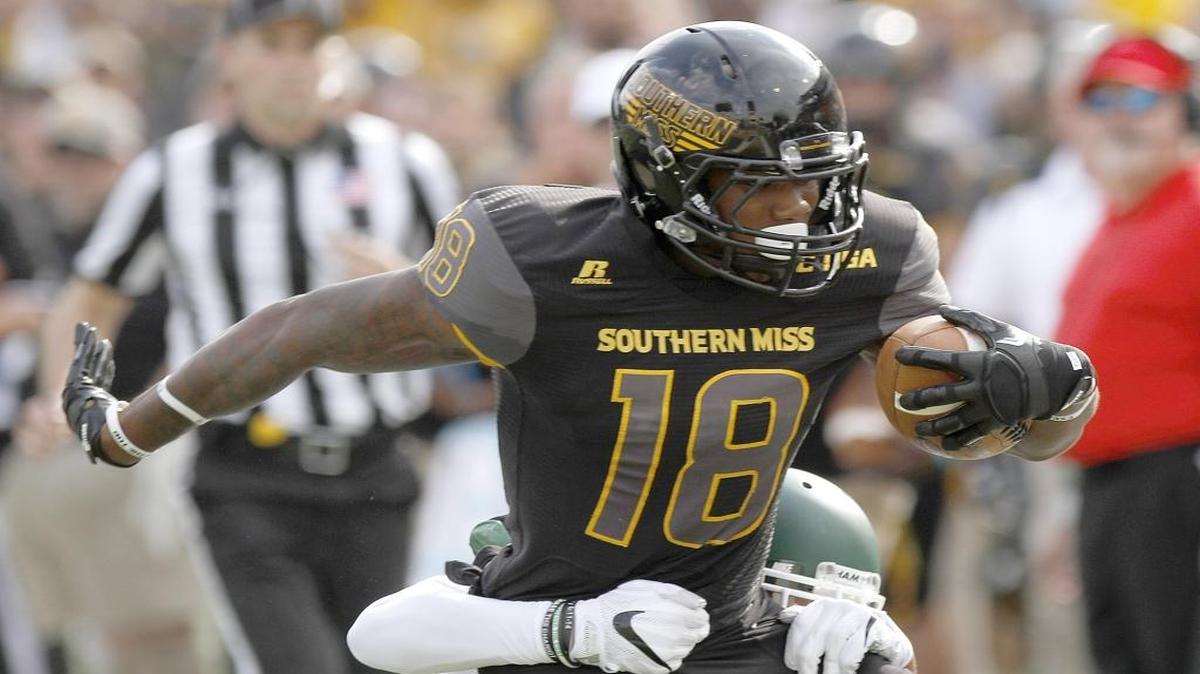 Southern Miss receiver Korey Robertson is brought down after making a first down against Charlotte in Hattiesburg on Nov. 5, 2016.