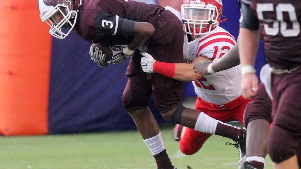Long Beach receiver Trevor Terry is tackled by a Biloxi defender during the 2015 Shrimp Bowl game at Milner Stadium in Gulfport. Terry committed to Southern Miss on Tuesday.