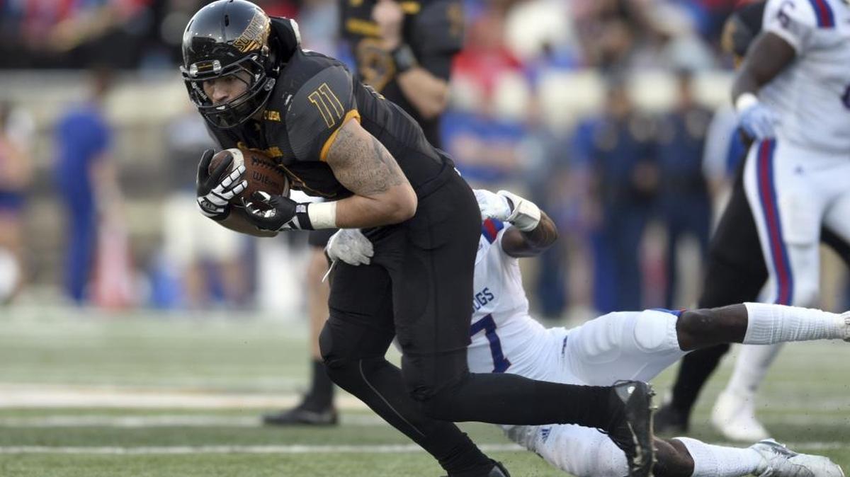 Southern Miss tight end Julian Allen tries to get away from a Louisiana Tech defender on Friday in Hattiesburg, Miss.